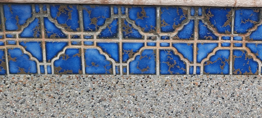 Blue speck pool water line after dustless blasting