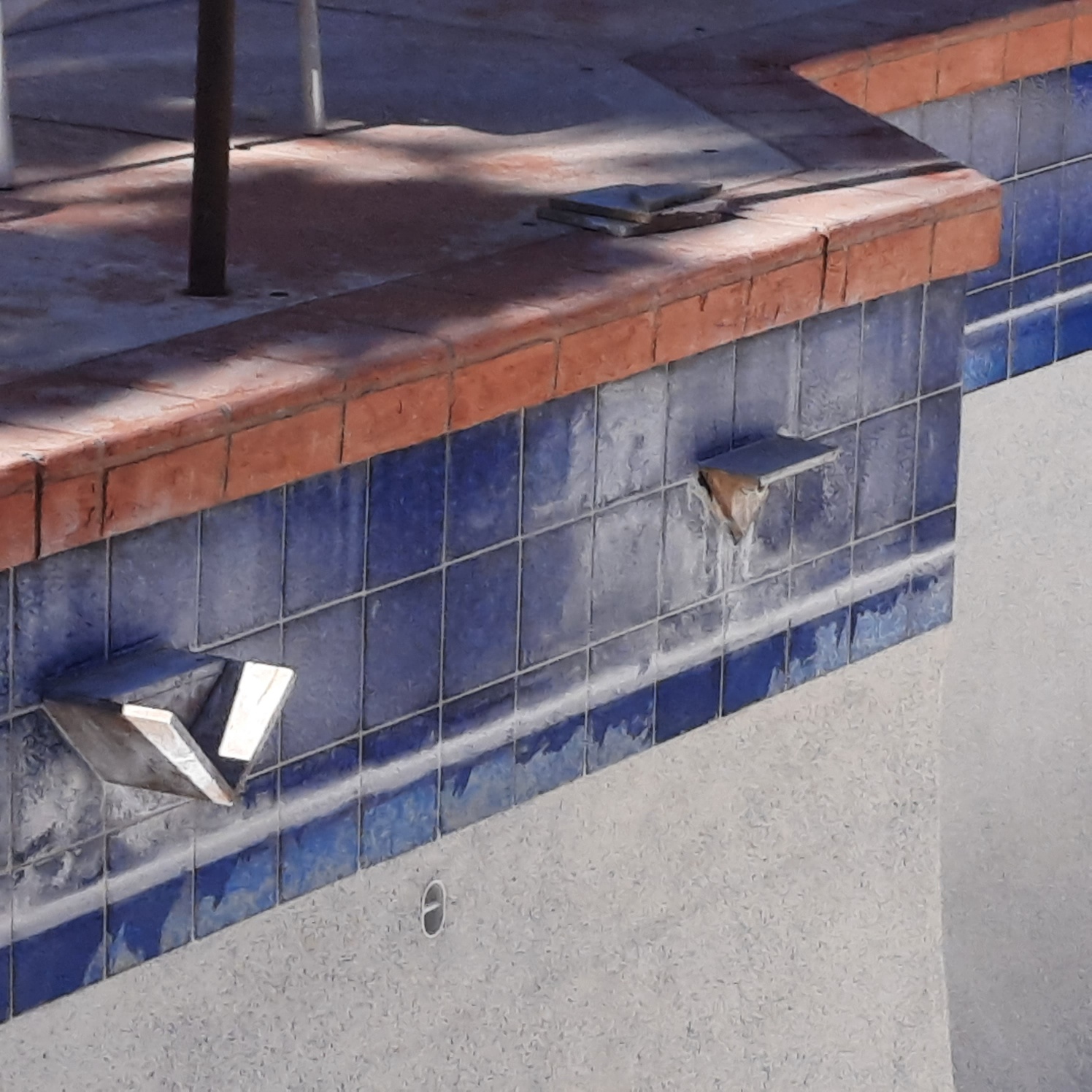 Pool water line before dustless blasting