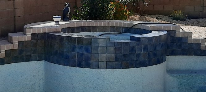 Dark blue pool water line after dustless blasting